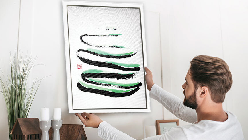 man hanging a framed art print by Manwol Son